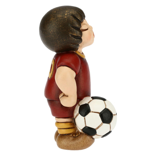 Bimbo calciatore giallo piccolo