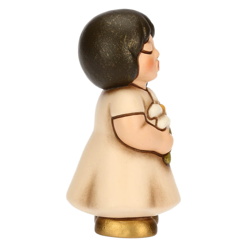 Bimba in ceramica con giglio