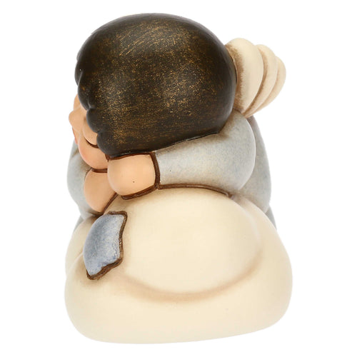 Angelo azzurro in ceramica su nuvola