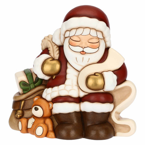 Babbo Natale con lista dei desideri in ceramica
