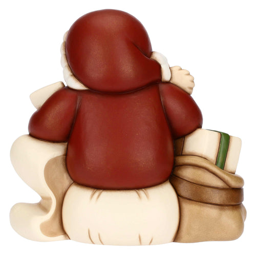 Babbo Natale con lista dei desideri in ceramica