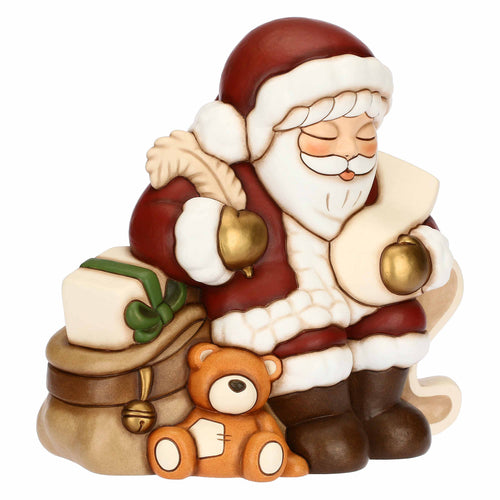 Babbo Natale con lista dei desideri in ceramica