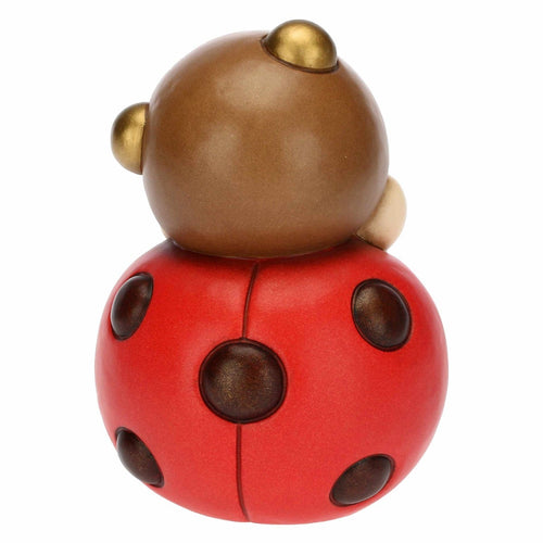 Coccinella con fiore grande