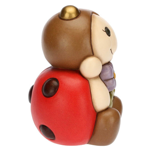 Coccinella con fiore grande