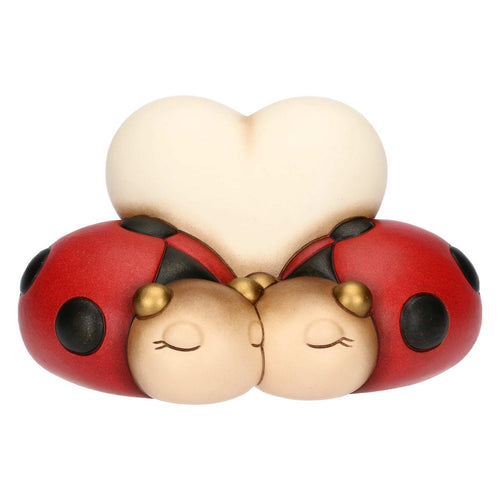 Coppia di coccinelle con cuore in ceramica